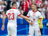 Krzysztof Piatek, Przemyslaw Frankowski  are playing during the UEFA Euro 2024 Group D match between Poland v Austria, at the Olympiastadion...