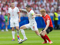 Piotr Zielinski, Nicolas Seiwald  are playing during the UEFA Euro 2024 Group D match between Poland v Austria, at the Olympiastadion in Ber...