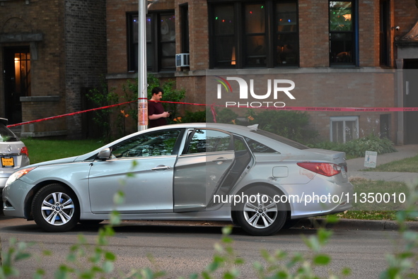 A vehicle is being damaged by bullet holes and blood at the crime scene. Three teenagers are being shot, with one dead, in a shooting in Chi...