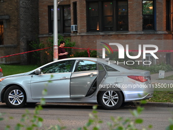 A vehicle is being damaged by bullet holes and blood at the crime scene. Three teenagers are being shot, with one dead, in a shooting in Chi...