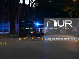 Shell casings are being located at the crime scene. Three teenagers are being shot, with one dead, in a shooting in Chicago, Illinois, Unite...