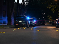 Shell casings are being located at the crime scene. Three teenagers are being shot, with one dead, in a shooting in Chicago, Illinois, Unite...