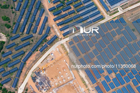 A general view of an agricultural 40 MW new energy photovoltaic power plant is being seen in the West Coast New Area of Qingdao, Shandong pr...