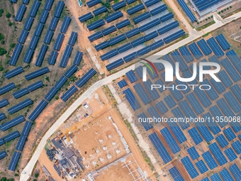 A general view of an agricultural 40 MW new energy photovoltaic power plant is being seen in the West Coast New Area of Qingdao, Shandong pr...