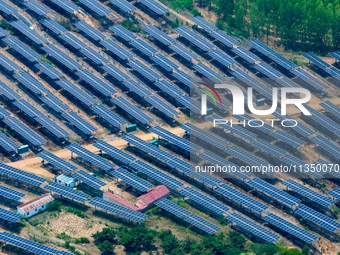 A general view of an agricultural 40 MW new energy photovoltaic power plant is being seen in the West Coast New Area of Qingdao, Shandong pr...