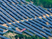 A general view of an agricultural 40 MW new energy photovoltaic power plant is being seen in the West Coast New Area of Qingdao, Shandong pr...