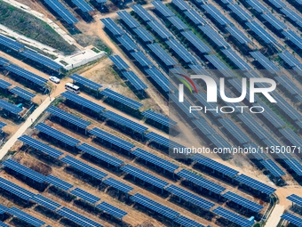 A general view of an agricultural 40 MW new energy photovoltaic power plant is being seen in the West Coast New Area of Qingdao, Shandong pr...