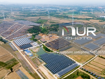 A general view of an agricultural 40 MW new energy photovoltaic power plant is being seen in the West Coast New Area of Qingdao, Shandong pr...