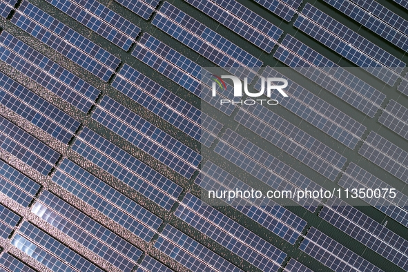 A general view of an agricultural 40 MW new energy photovoltaic power plant is being seen in the West Coast New Area of Qingdao, Shandong pr...