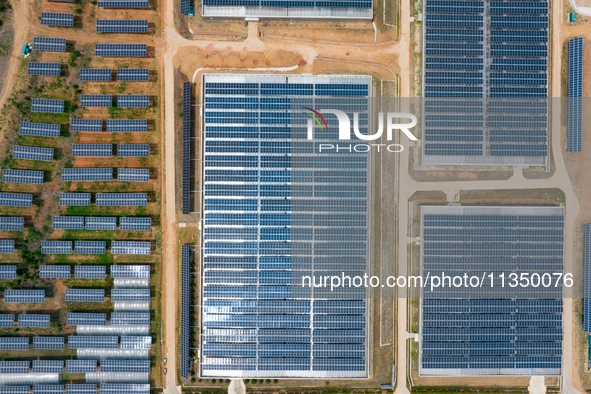 A general view of an agricultural 40 MW new energy photovoltaic power plant is being seen in the West Coast New Area of Qingdao, Shandong pr...