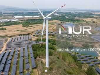 A general view of an agricultural 40 MW new energy photovoltaic power plant is being seen in the West Coast New Area of Qingdao, Shandong pr...