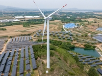 A general view of an agricultural 40 MW new energy photovoltaic power plant is being seen in the West Coast New Area of Qingdao, Shandong pr...