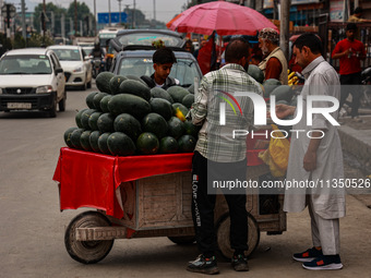 People are purchasing fruits on a cloudy day in Srinagar, Jammu and Kashmir, India, on June 22, 2024 (