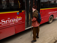 An elderly man is waiting for the Smart City Bus at a bus stop in Srinagar, Jammu and Kashmir, India, on June 22, 2024. (