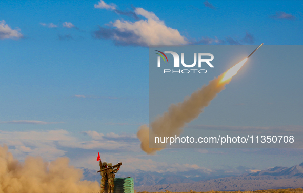 A missile is being launched to strike a low-altitude target during a live-fire tactical drill in Jiuquan, China, on June 20, 2024. 