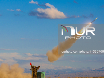 A missile is being launched to strike a low-altitude target during a live-fire tactical drill in Jiuquan, China, on June 20, 2024. (