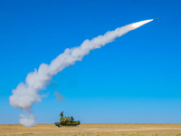 A missile is lifting off to intercept a high-altitude target during a live-fire tactical drill in Jiuquan, Gansu province, China, on June 20...