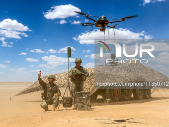 Officers and soldiers are conducting intelligence reconnaissance during a live-fire tactical exercise in Jiuquan, Gansu province, China, on...