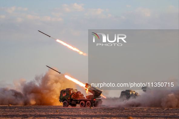 A rocket launcher unit is conducting collective fire during a live-fire tactical drill in Jiuquan, Gansu province, China, on June 20, 2024. 