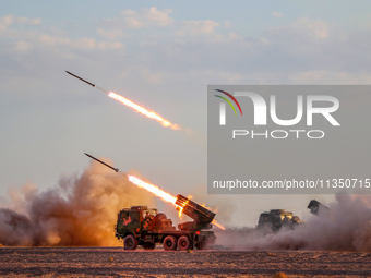 A rocket launcher unit is conducting collective fire during a live-fire tactical drill in Jiuquan, Gansu province, China, on June 20, 2024....