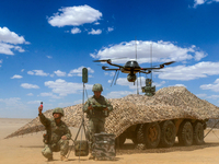 Officers and soldiers are conducting intelligence reconnaissance during a live-fire tactical exercise in Jiuquan, Gansu province, China, on...