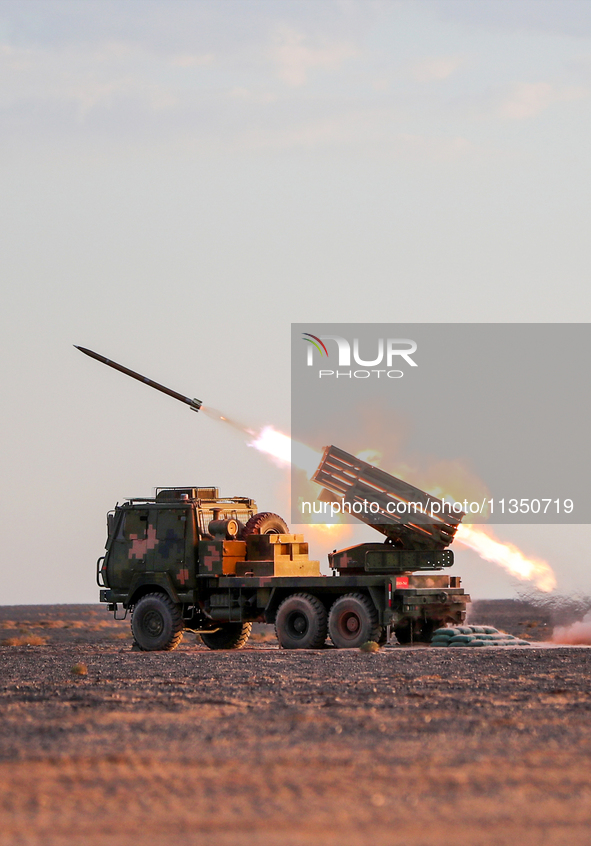 A rocket launcher unit is conducting collective fire during a live-fire tactical drill in Jiuquan, Gansu province, China, on June 20, 2024. 