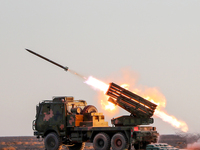 A rocket launcher unit is conducting collective fire during a live-fire tactical drill in Jiuquan, Gansu province, China, on June 20, 2024....