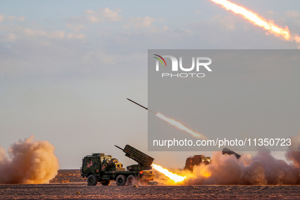 A rocket launcher unit is conducting collective fire during a live-fire tactical drill in Jiuquan, Gansu province, China, on June 20, 2024. 