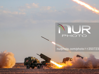 A rocket launcher unit is conducting collective fire during a live-fire tactical drill in Jiuquan, Gansu province, China, on June 20, 2024....