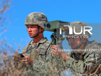 Officers and soldiers are quickly capturing targets during a live-fire tactical drill in Jiuquan, Gansu province, China, on June 20, 2024. (