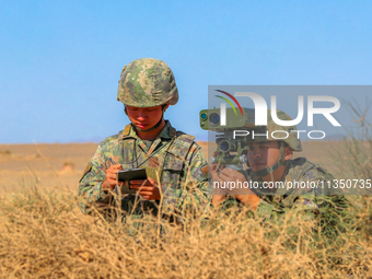 Officers and soldiers are quickly capturing targets during a live-fire tactical drill in Jiuquan, Gansu province, China, on June 20, 2024. (