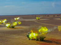 An artillery unit is covering a forward position during a live-fire tactical drill in Jiuquan, Gansu province, China, on June 20, 2024. (