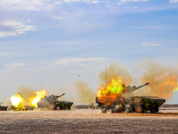 A howitzer unit is striking a target during a live-fire tactical drill in Jiuquan, Gansu province, China, on June 20, 2024. (