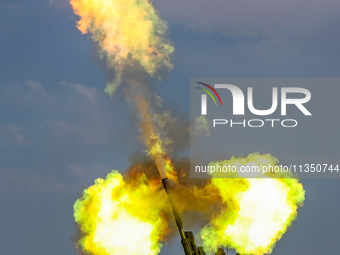 An artillery unit is conducting extreme firing during a live-fire tactical drill in Jiuquan, Gansu province, China, on June 20, 2024. (