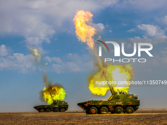 An artillery unit is conducting extreme firing during a live-fire tactical drill in Jiuquan, Gansu province, China, on June 20, 2024. (