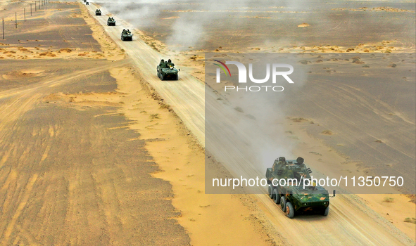 Artillery units are moving rapidly towards the assembly area during a live-fire tactical drill in Jiuquan, China, on June 20, 2024. 