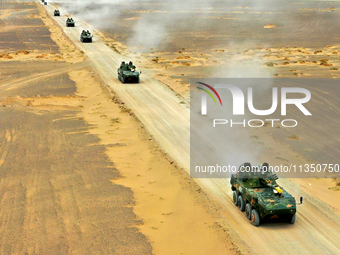 Artillery units are moving rapidly towards the assembly area during a live-fire tactical drill in Jiuquan, China, on June 20, 2024. (