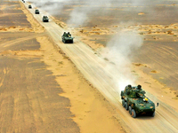 Artillery units are moving rapidly towards the assembly area during a live-fire tactical drill in Jiuquan, China, on June 20, 2024. (