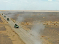 Artillery units are moving rapidly towards the assembly area during a live-fire tactical drill in Jiuquan, China, on June 20, 2024. (