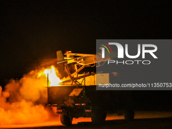 A drone is taking off at night to conduct aerial reconnaissance during a live-fire tactical drill in Jiuquan, Gansu province, China, on June...