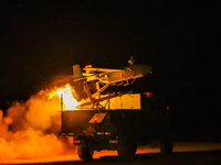 A drone is taking off at night to conduct aerial reconnaissance during a live-fire tactical drill in Jiuquan, Gansu province, China, on June...