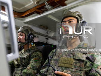 A command terminal operator is giving a quick order during a live-fire tactical drill in Jiuquan, Gansu province, China, on June 20, 2024. (