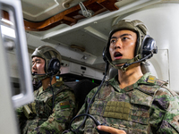 A command terminal operator is giving a quick order during a live-fire tactical drill in Jiuquan, Gansu province, China, on June 20, 2024. (