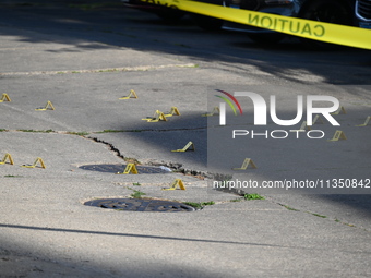 Shell casings are being located at the crime scene. A 34-year-old male victim is being shot multiple times and killed in Chicago, Illinois,...