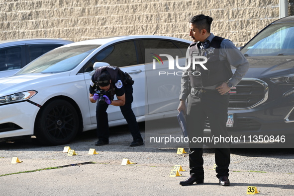 Shell casings are being located at the crime scene. A 34-year-old male victim is being shot multiple times and killed in Chicago, Illinois,...