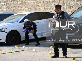 Shell casings are being located at the crime scene. A 34-year-old male victim is being shot multiple times and killed in Chicago, Illinois,...