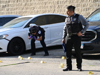 Shell casings are being located at the crime scene. A 34-year-old male victim is being shot multiple times and killed in Chicago, Illinois,...