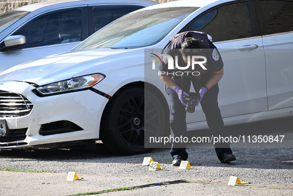 Shell casings are being located at the crime scene. A 34-year-old male victim is being shot multiple times and killed in Chicago, Illinois,...