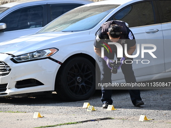 Shell casings are being located at the crime scene. A 34-year-old male victim is being shot multiple times and killed in Chicago, Illinois,...