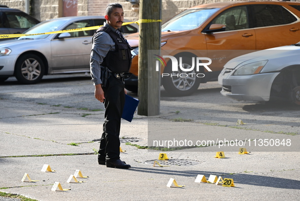 Shell casings are being located at the crime scene. A 34-year-old male victim is being shot multiple times and killed in Chicago, Illinois,...